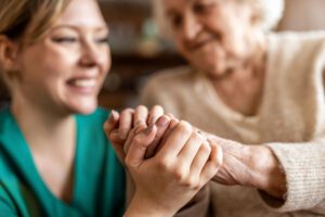 caregiver and elderly person with mild cognitive impairment